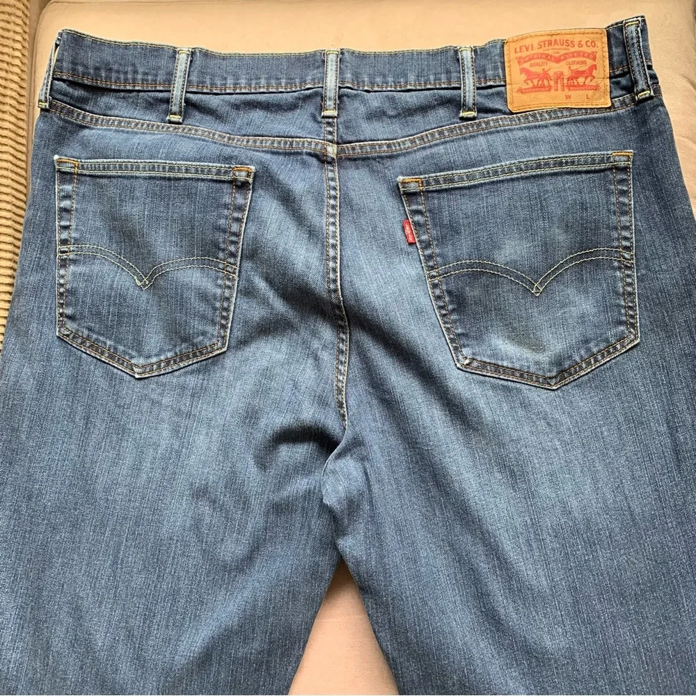 LEVIS.‎ Jeans, five pockets. Fraying on hem, and distressed W38/L34. Zipp…